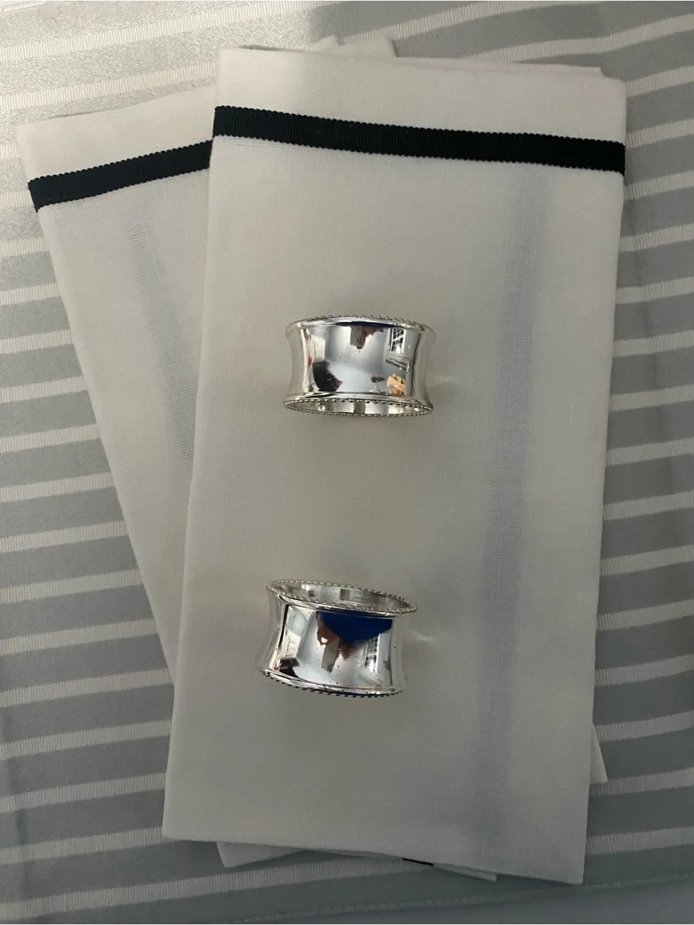 White and Black Trim napkins plus grey and white strip place mats.  Kate Spade.
